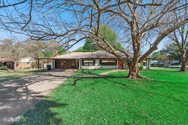 ranch-style house featuring a carport and a front lawn