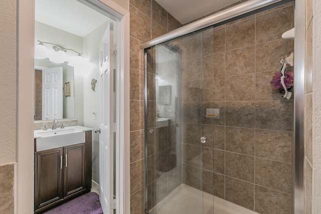 bathroom featuring vanity and walk in shower