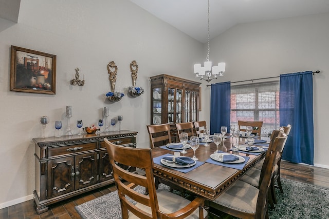 dining area with dark wood-type flooring, high vaulted ceiling, and a notable chandelier