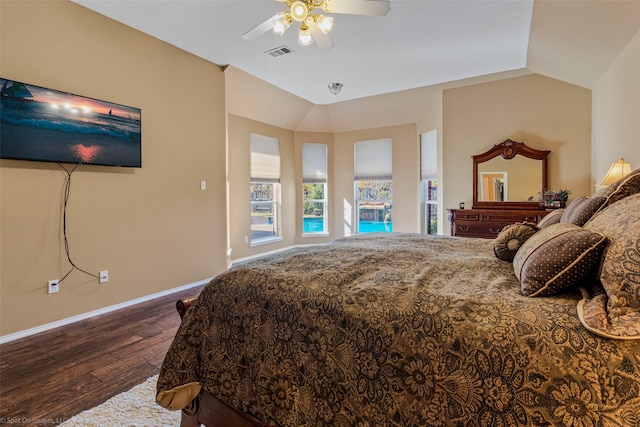 bedroom with wood-type flooring, ceiling fan, and lofted ceiling