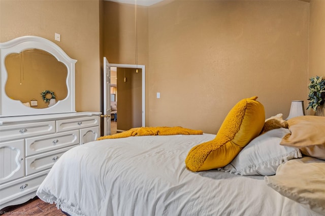 bedroom with hardwood / wood-style flooring