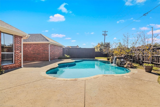 view of swimming pool featuring a patio and pool water feature