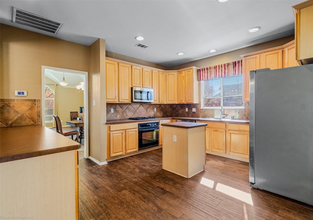 kitchen featuring tasteful backsplash, light brown cabinetry, dark hardwood / wood-style floors, and appliances with stainless steel finishes