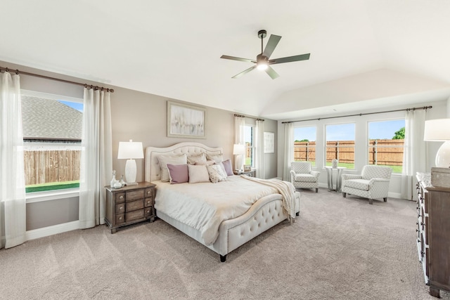 carpeted bedroom featuring ceiling fan and lofted ceiling