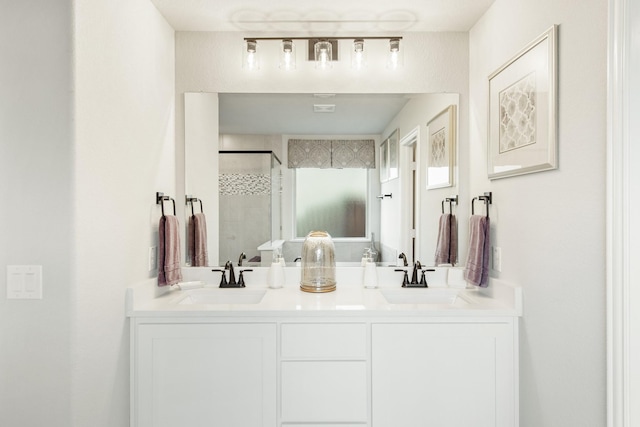 bathroom featuring vanity and a shower with door