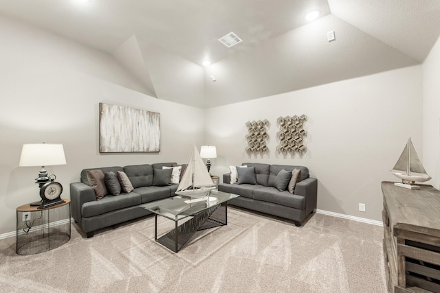 carpeted living room featuring lofted ceiling