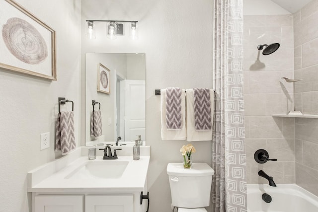 full bathroom featuring shower / tub combo with curtain, vanity, and toilet