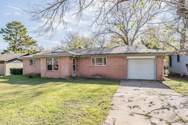 ranch-style home with a front yard and a garage