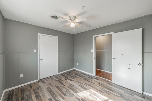 unfurnished bedroom featuring ceiling fan and light hardwood / wood-style floors