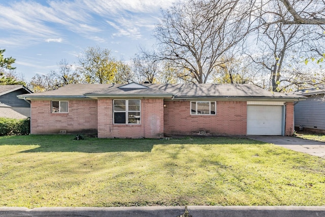 ranch-style house featuring a front yard and a garage