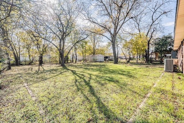 view of yard featuring central AC unit