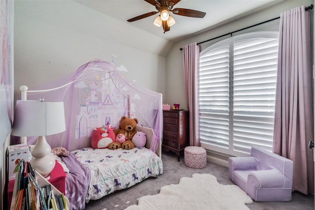 carpeted bedroom featuring vaulted ceiling and ceiling fan