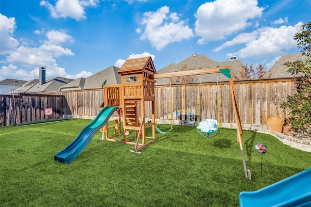 view of playground with a yard