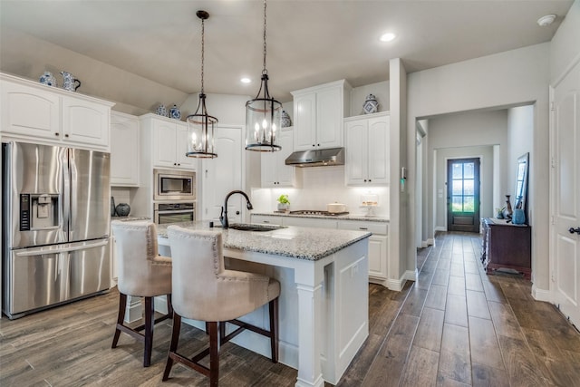 kitchen featuring white cabinetry, sink, an island with sink, and appliances with stainless steel finishes