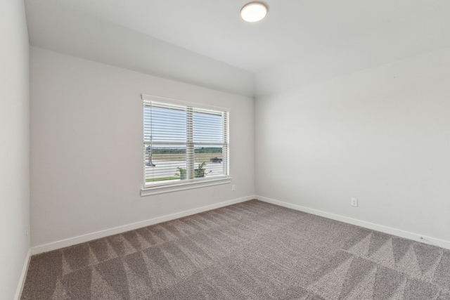 empty room with dark carpet