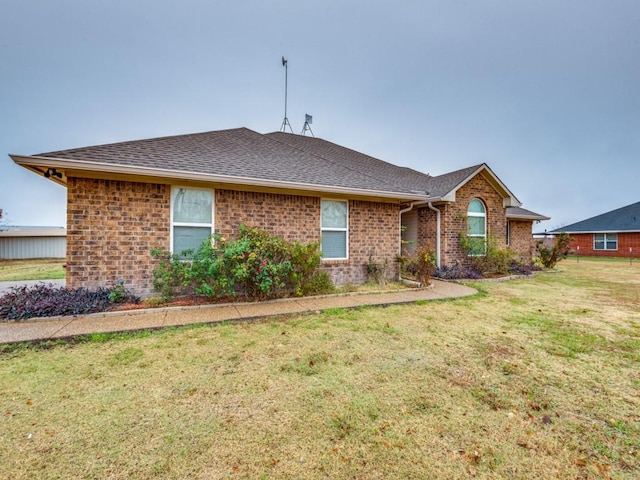 ranch-style house with a front lawn