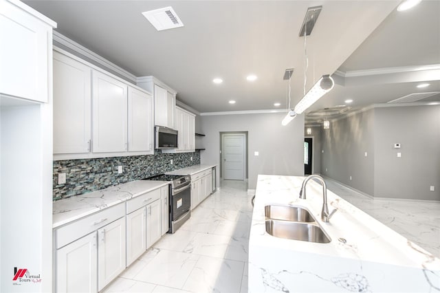 kitchen featuring light stone countertops, sink, hanging light fixtures, stainless steel appliances, and white cabinets