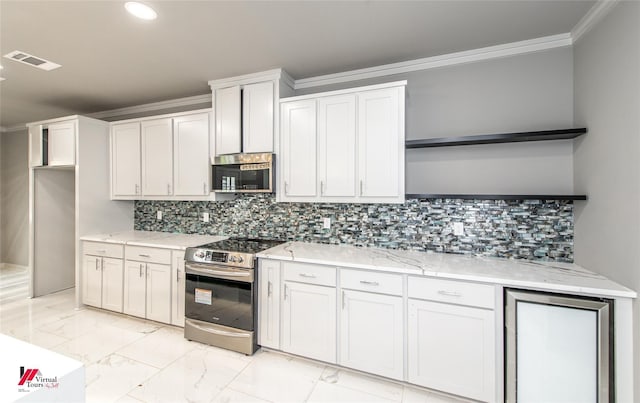 kitchen with stainless steel appliances, light stone counters, decorative backsplash, white cabinets, and ornamental molding