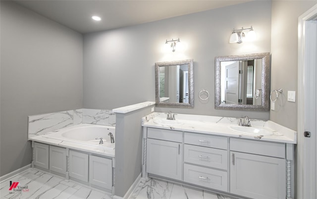 bathroom featuring a washtub and vanity