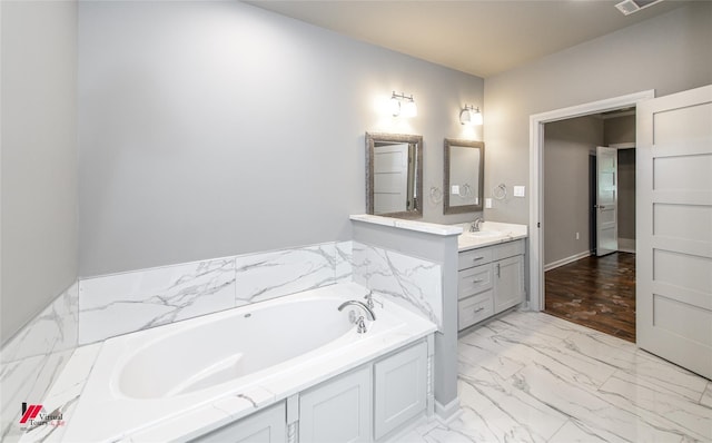 bathroom featuring vanity and a bathtub