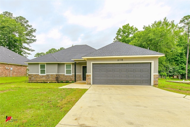 view of front facade with a front yard and a garage