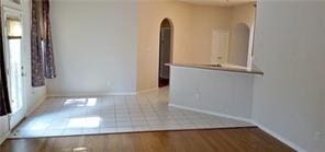 spare room with hardwood / wood-style flooring