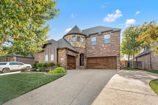 view of front of property with a front lawn and a garage