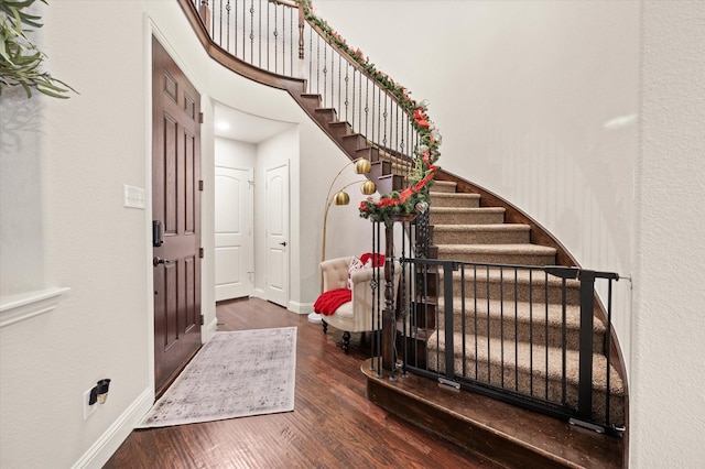 foyer entrance featuring dark hardwood / wood-style floors