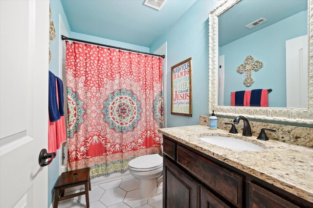 bathroom with toilet, tile patterned flooring, a shower with shower curtain, and vanity