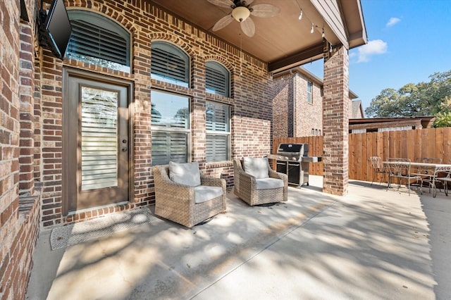 view of patio featuring ceiling fan and a grill