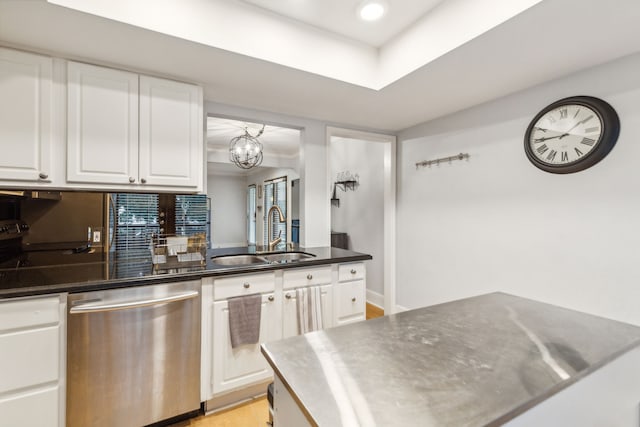 kitchen featuring light wood-type flooring, stainless steel dishwasher, sink, a notable chandelier, and white cabinetry