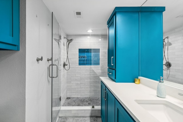 bathroom with vanity and walk in shower