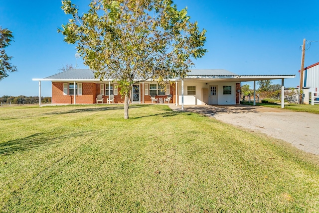 ranch-style house with a carport and a front yard