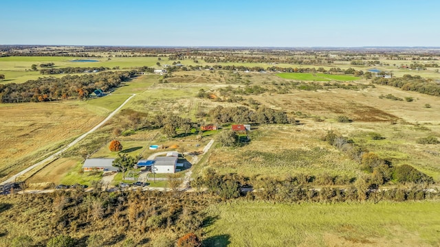 birds eye view of property with a rural view