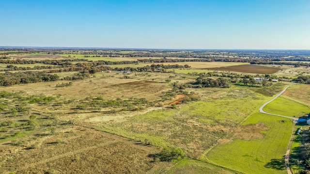 birds eye view of property with a rural view