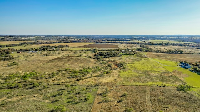 birds eye view of property with a rural view