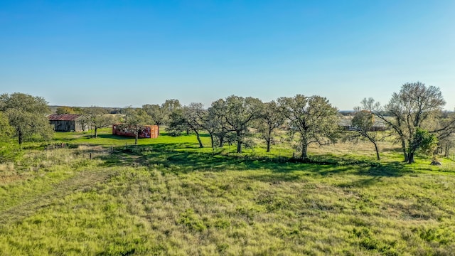 view of yard with a rural view