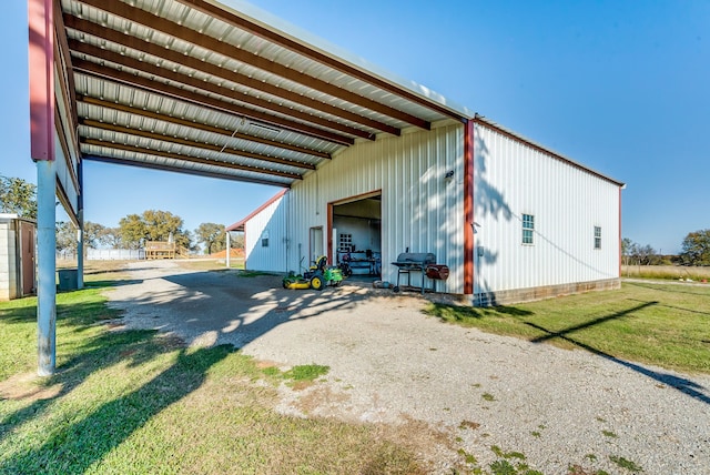 view of home's exterior with an outbuilding and a garage