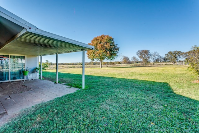 view of yard with a patio and a rural view