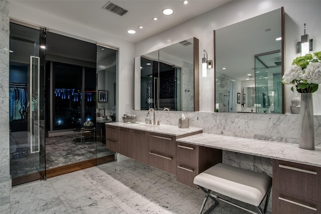 bathroom featuring a shower, vanity, and backsplash