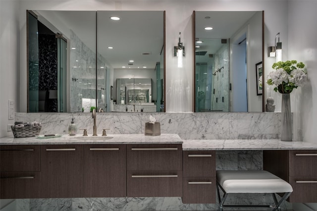 bathroom featuring tasteful backsplash, vanity, and walk in shower