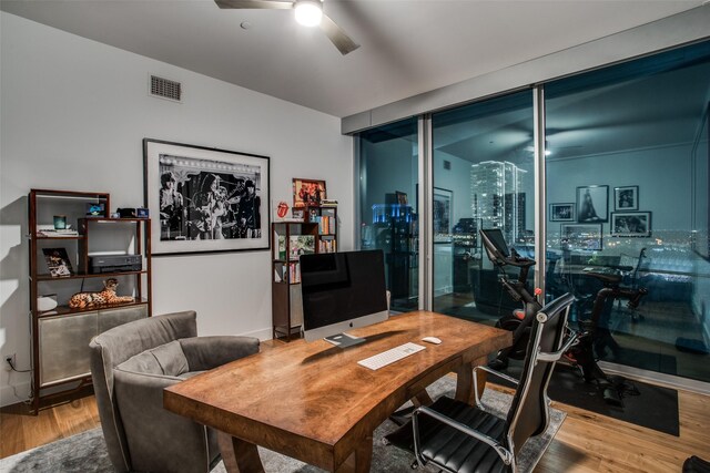 office space with hardwood / wood-style floors and ceiling fan