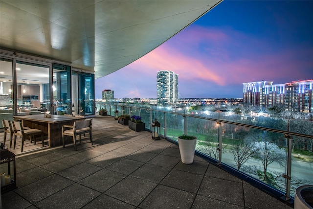 view of balcony at dusk