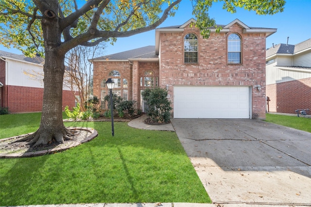 view of front of property with a front yard and a garage