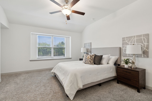 bedroom featuring ceiling fan, light carpet, and vaulted ceiling