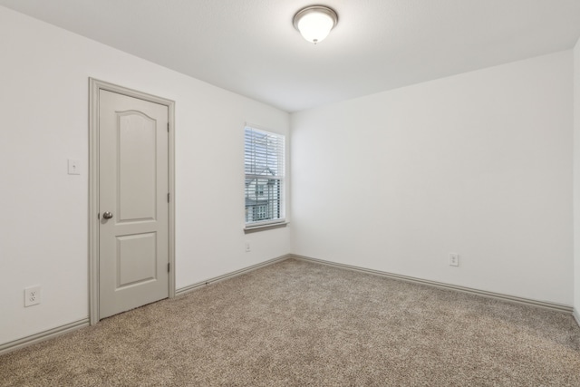 unfurnished room featuring carpet floors