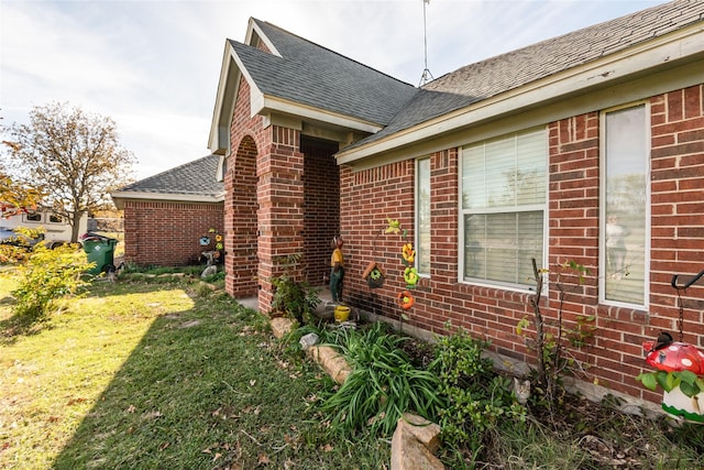 view of property exterior with a yard