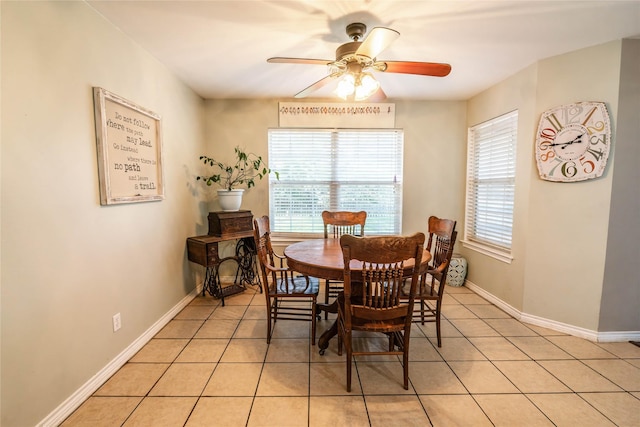 dining area featuring light tile patterned floors and ceiling fan