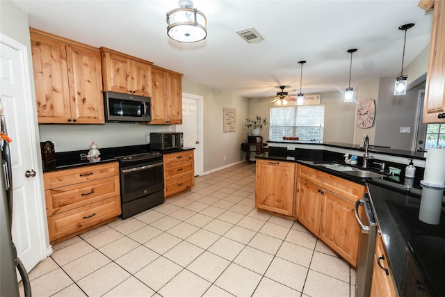 kitchen with black electric range oven, sink, hanging light fixtures, ceiling fan, and light tile patterned floors