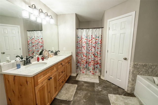 bathroom with vanity and a tub